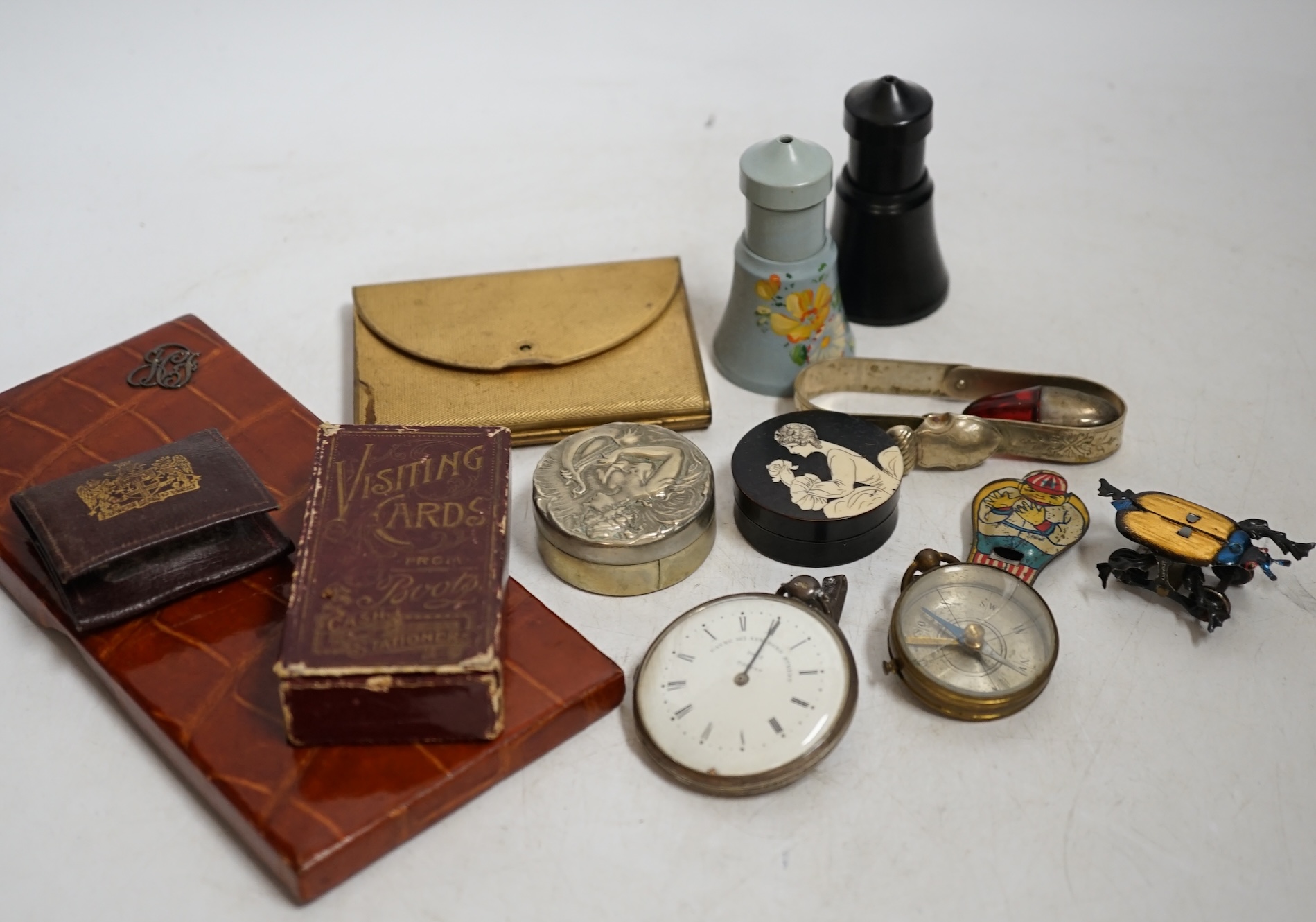A group of mixed collectables and objects to include Bakelite boxes, pen knives, white metal charms and a gilt metal compact, etc. Condition - varies, fair